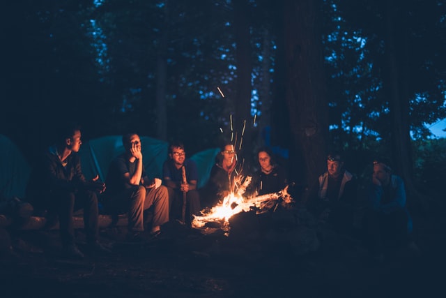 group of friends enjoying a campfire