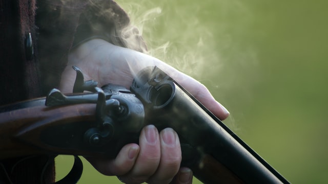 Clay Pigeon vs Air Rifle; a person loading a rifle
