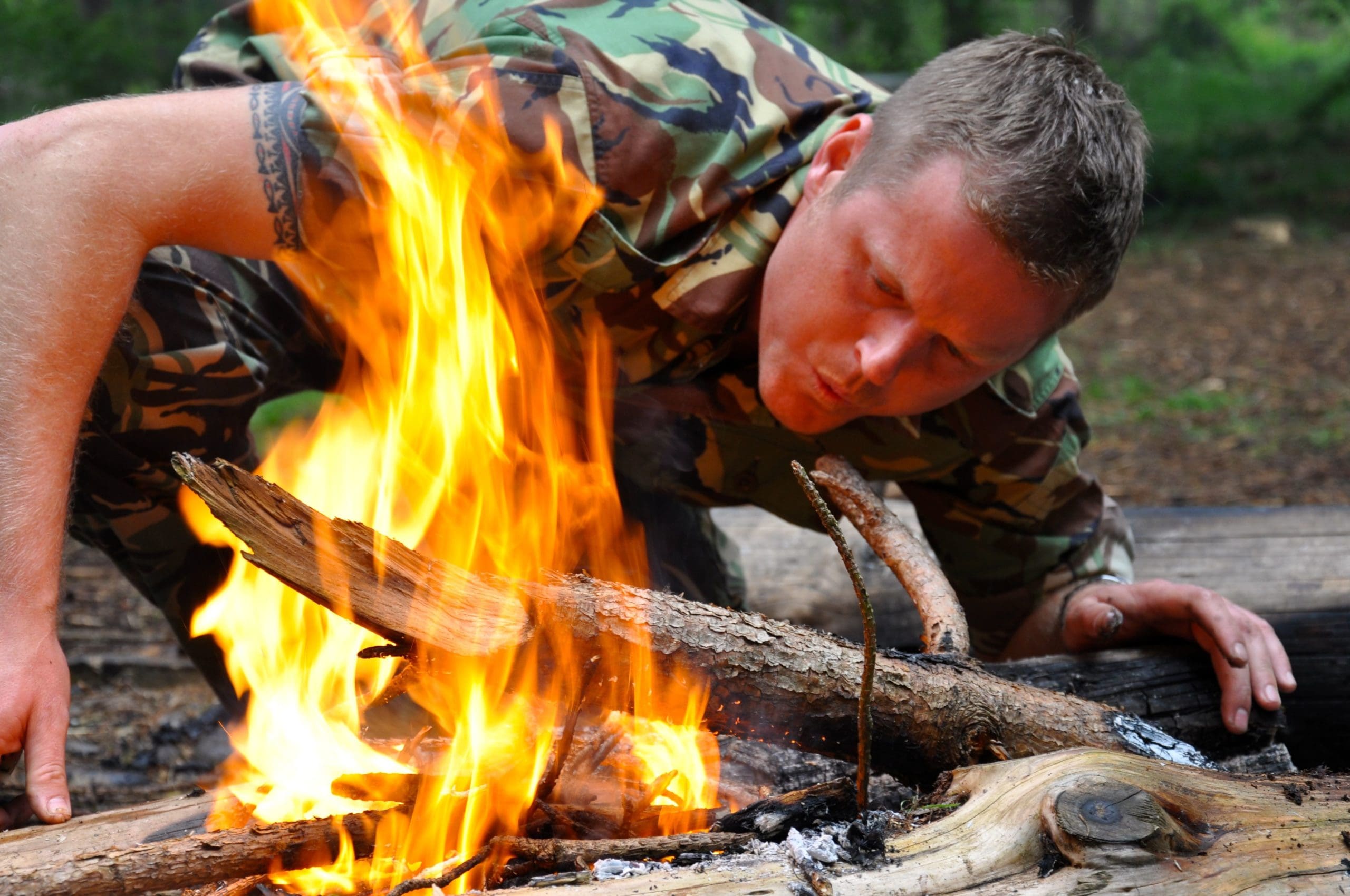 action adventure activities; a person trying to light fire