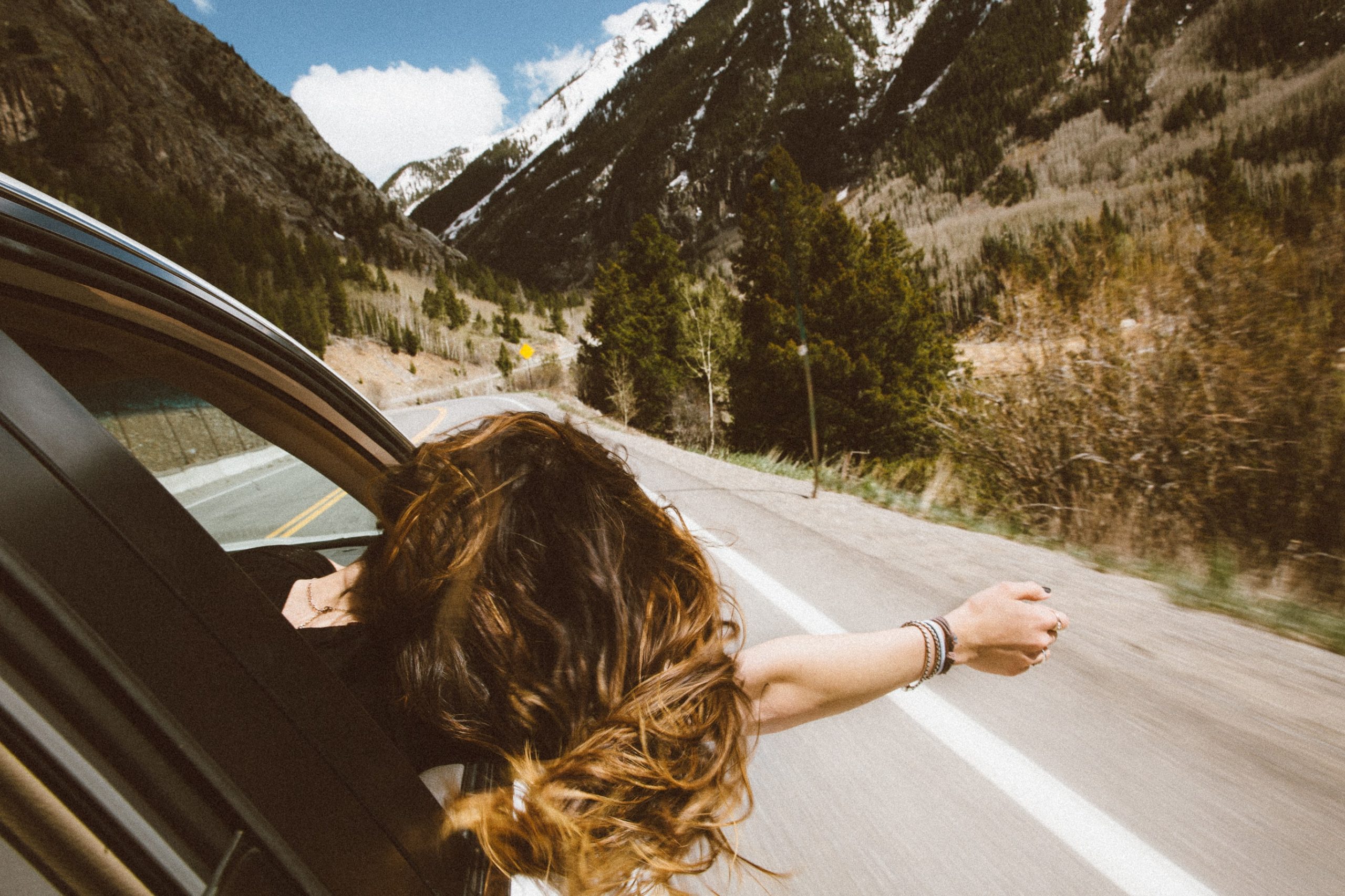 father's day ideas; a woman at a road trip